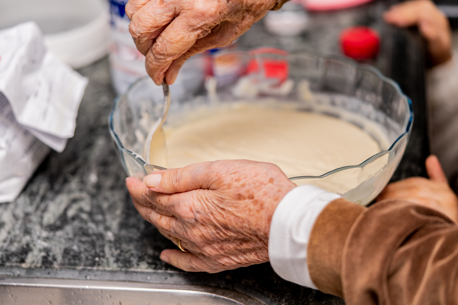 Grandmother cooking, preparing a delicious food.